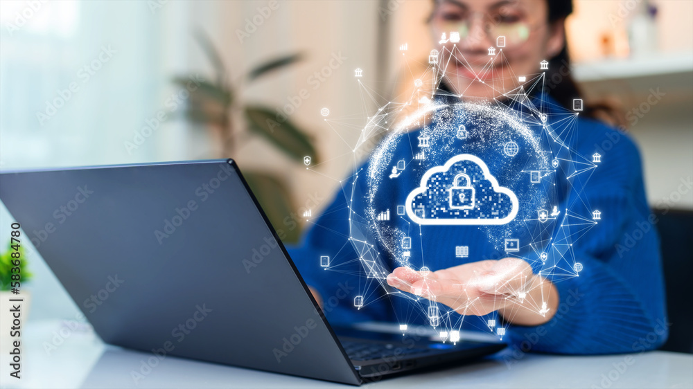 Woman uploading and transferring data from computer to cloud computing. Digital technology concept, data sheet management with large database capacity and high security.